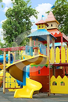 New colorful castle playhouse with slide on children`s playground