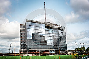 New Commercial building construction and city reflection