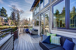 New construction home exterior boasts luxury deck photo