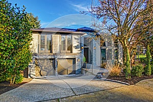 New construction home exterior with elegant stone porch