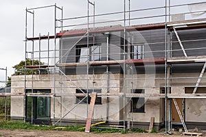 On the new construction of a home still stands the scaffolding
