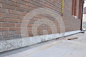 New construction waterproofing basement walls from outside.