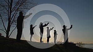 New coronavirus  silhouette of people praying to God with open hands  copy space