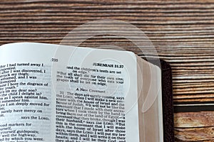 New covenant prophecy verses in open holy bible book, a closeup photo