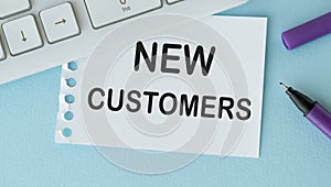 New customers text concept write on paper notebook
