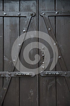 New dark brown wooden door with metal handles and keylock
