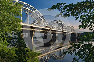 New Darnytskyi Bridge across Dnipro river in Kyiv, Ukraine on calm spring day