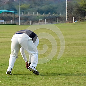 New Delhi India â€“ July 01 2018 : Full length of cricketer playing on field during sunny day in local playground, Cricketer on