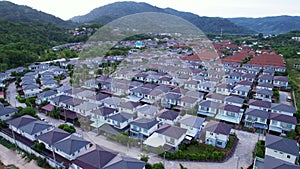 New development real estate. Aerial view of residential houses and driveways neighborhood during a fall sunset or sunrise time.Tig