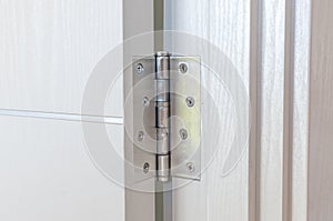 New door hinges Aluminum on white door photo