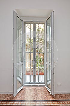 New double glazed open window with gate in white, renovated apartment