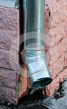 A new drainpipe on a corner of a building