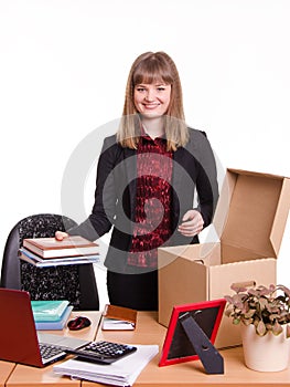 New employee in the office arranges personal belongings