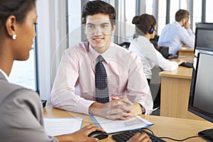 New Employee Starting Work In Busy Office