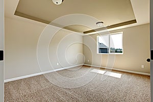 New empty room with beige carpet.