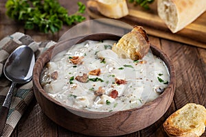 New England clam chowder with bacon, parsley and toasted bread