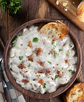 New England clam chowder with bacon, parsley and toasted bread