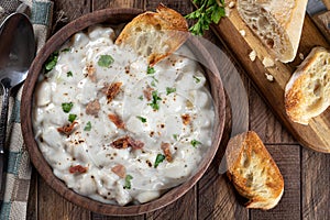 New England clam chowder with bacon, parsley and toasted bread