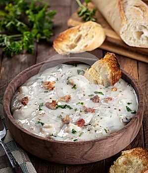 New England clam chowder with bacon, parsley and toasted bread