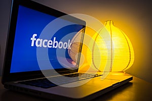 New facebook logo on a computer screen, turned on the light in the background