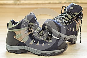 New fashionable hiking mountain boots. Modern leather trekking f