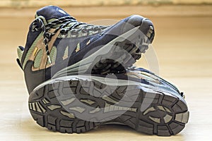 New fashionable hiking mountain boots. Modern leather trekking f