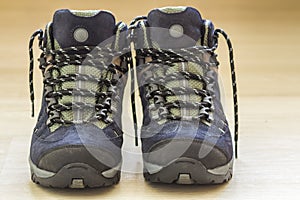 New fashionable hiking mountain boots. Modern leather trekking f