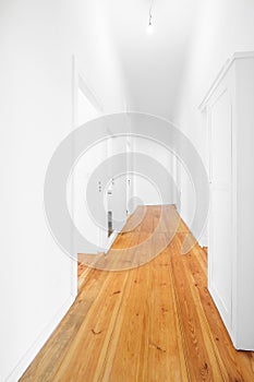 New flat corridor, empty hallway woith wooden floor