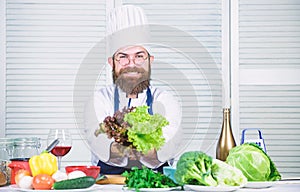 New food. Vegetarian. Mature chef with beard. Healthy food cooking. Dieting and organic food, vitamin. Bearded man cook
