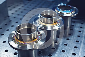 New freshly welded stainless steel flanges. Demonstration of reference multi-colored seams