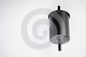 New fuel filter in a black plastic housing for diesel and gasoline engines on a gray background