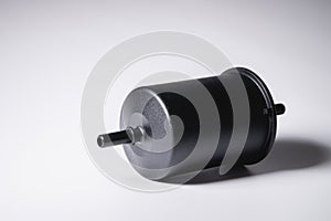 New fuel filter in a black plastic housing for diesel and gasoline engines on a gray background