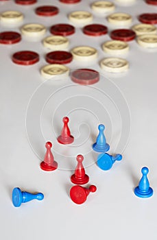 New game markers in red & blue. Some have fallen over so the game has begun. Old check chips are in the background.