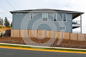 New Garden Wood Fence Around House in suburban area photo