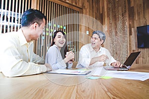 A new generation of Asian entrepreneurs sit for business planning meetings.