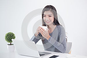 New generation asians business woman sitting and drinking coffee photo