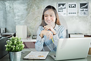 New generation asians business woman using laptop at office,Asian women sitting smiling while working on mobile office concept