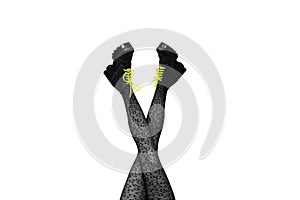 New gray female boots with bright yellow laces on long slender crossed woman legs in gray tights isolated on white