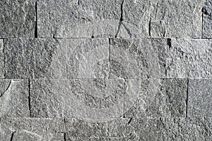 New gray stone cladding plates on wall