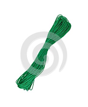 New green nylon utility rope isolated on white background without shadow. A coil of green rope in close-up