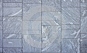 New grey paving made with stone blocks of rectangular shape in a pedestrian zone