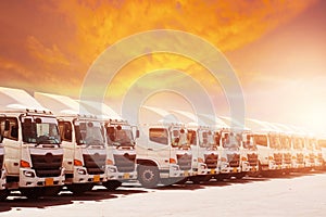 New haulage truck fleet is parking narrow at yard with sunset