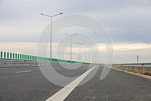 New highway motorway after construction and repair in a cloudy day.