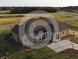 New home construction from above. Aerial view of suburban house. American neighborhood, suburb. Summer, sunny day