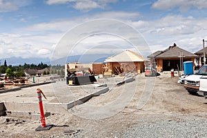 New home construction site with partially built homes