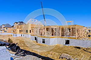 New home development construction site unfinished houses