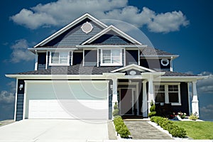 New Home House Blue Exterior Dramatic Blue Sky Background photo