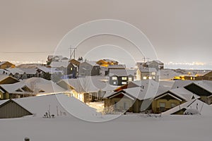 New homes being built in a hilltop subdivision in the suburbs of Spokane Washington covered in fog and snow during winter