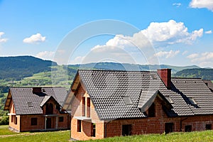 New homes created on green hills. Rural landscape.