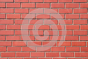 New horizontal wall of clear red bricks. Textured background
